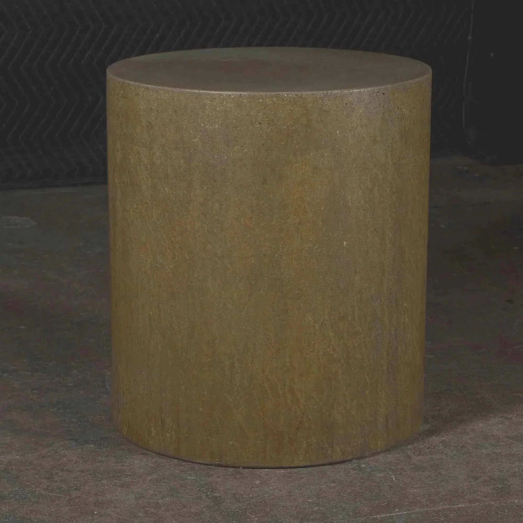 Hand-cast GFRC concrete cylinder with weathered rust patina and oxidized steel appearance from The Concrete Anomaly.