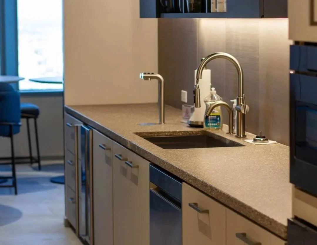 Architectural concrete countertop and integrated sink installation fabricated by The Concrete Anomaly for the Glenmede headquarters project in Philadelphia, Pennsylvania.