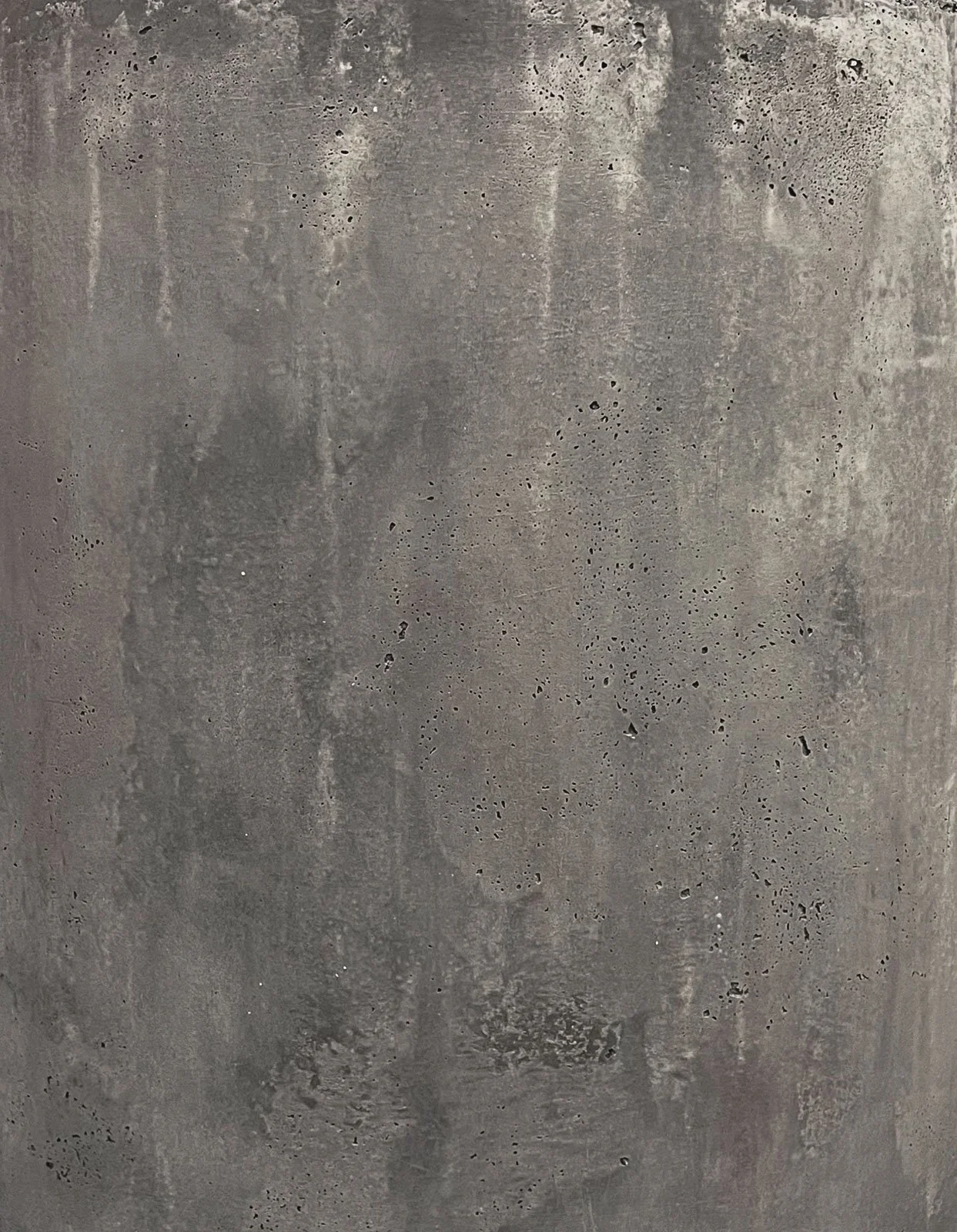 Concrete surface finish with mineral texture, tonal variation, and porous architectural detailing from the line RAW series.