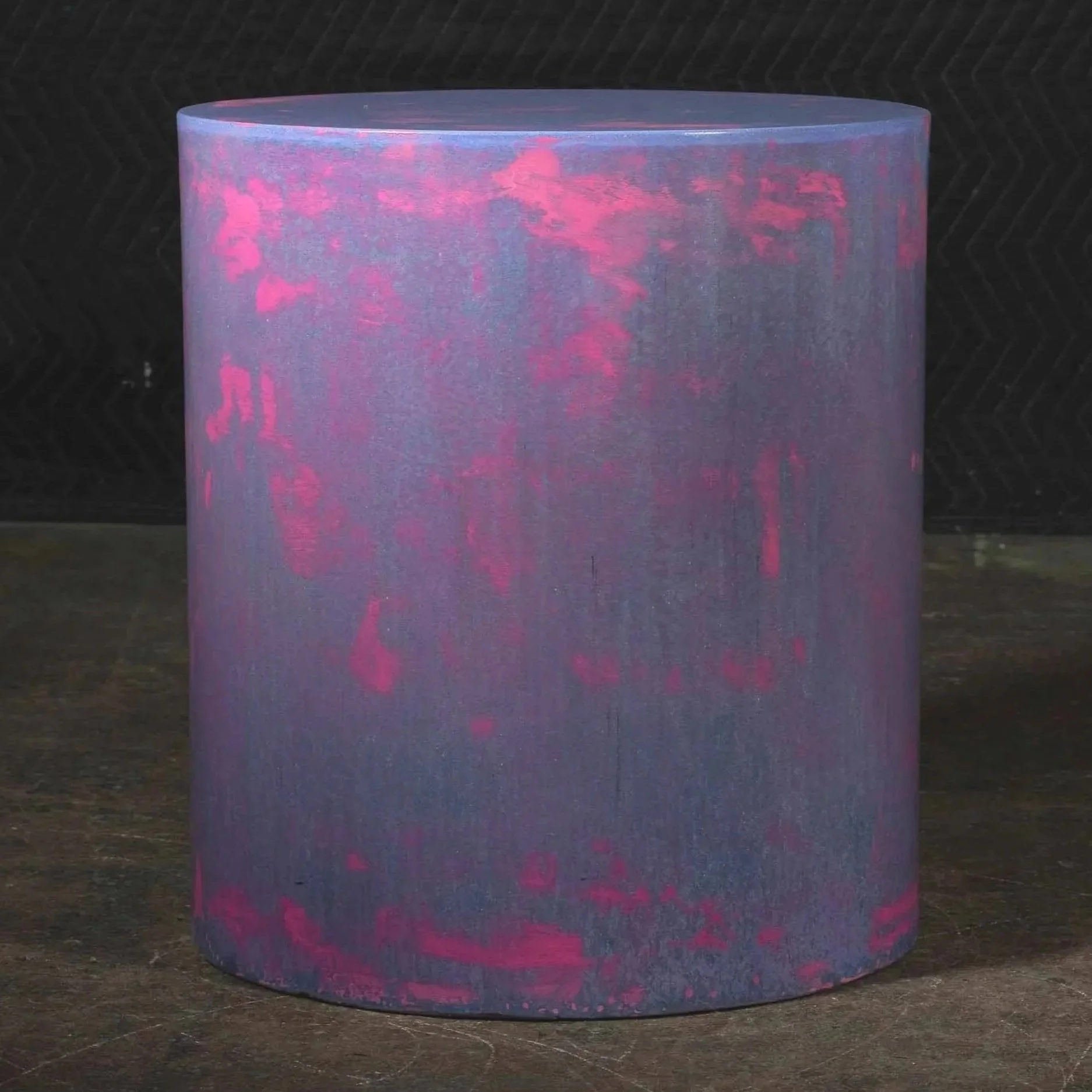 Hand-cast GFRC concrete cylinder featuring atmospheric purple surface tones, distressed neon pink erosion, and sculptural monolithic form from The Concrete Anomaly