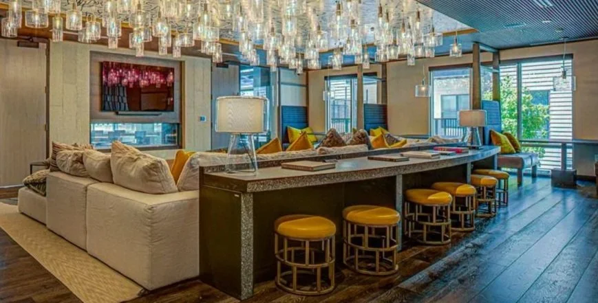 Installed monolithic architectural concrete bar and communal table system at Centro Apartments in Arlington, Virginia designed for integrated hospitality use.