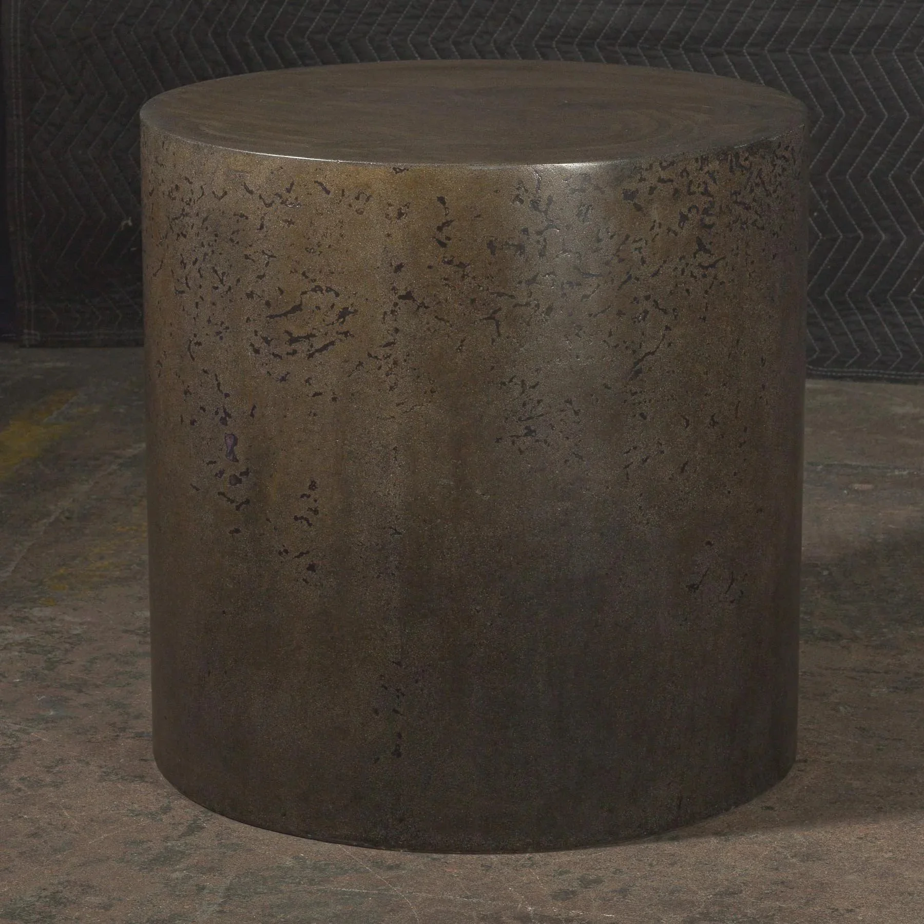 Hand-cast GFRC concrete cylinder featuring oxidized bronze tones and refined industrial surface texture.