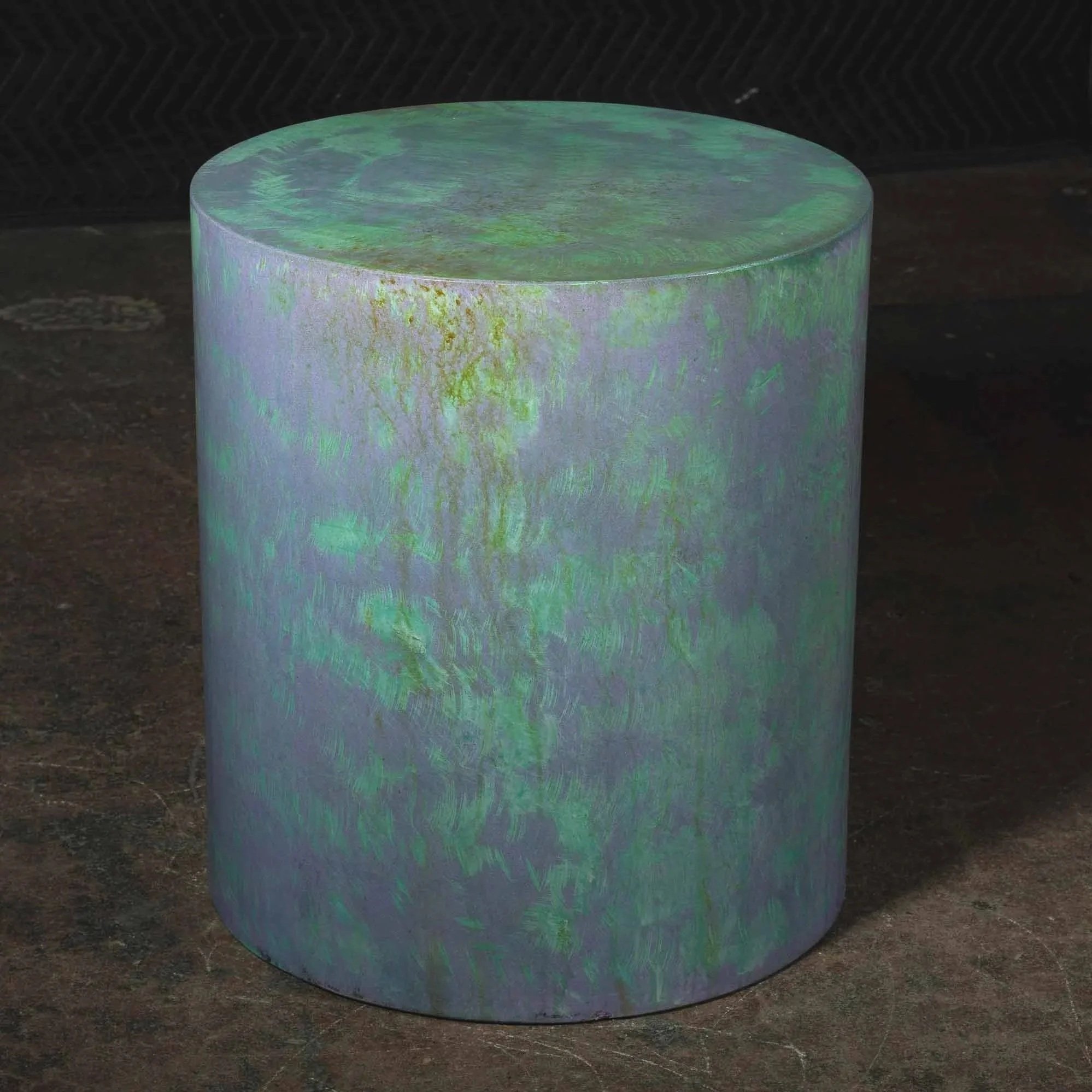 Hand-cast GFRC concrete cylinder featuring atmospheric oxidation tones, surface depth, and evolving pigment variation from The Concrete Anomaly.