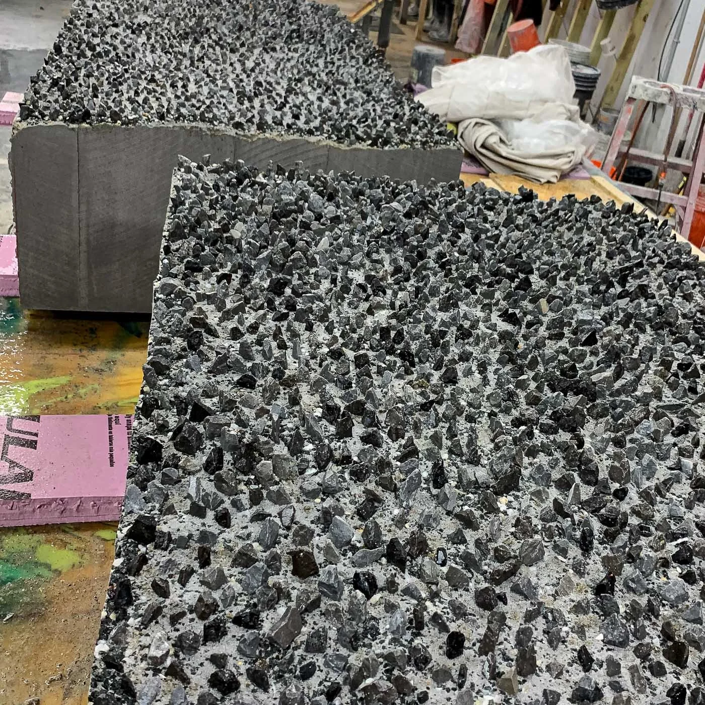 Close-up of the fractured, exposed-aggregate concrete surfaces used in the monumental LOVE sculpture.
