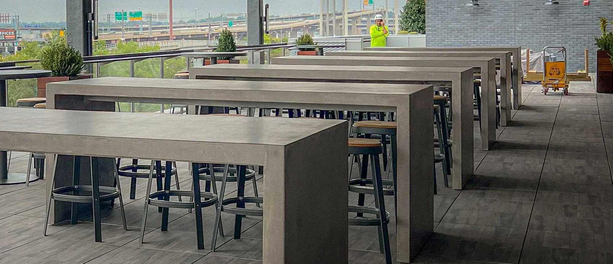 Custom GFRC concrete communal tables created by The Concrete Anomaly for the Miller Lite Pavilion at M&T Bank Stadium in Baltimore, Maryland, developed for Gensler.
