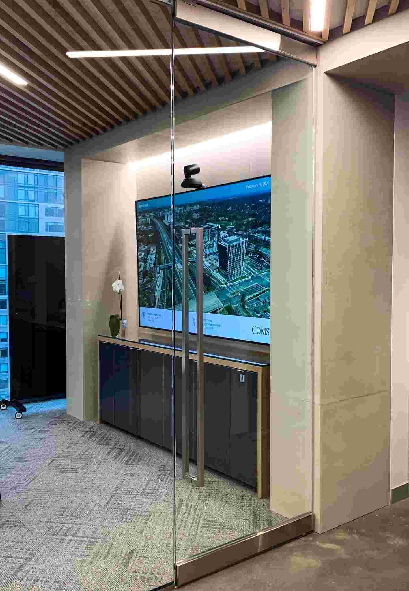 Architectural concrete wall and column wraps with integrated openings in modern interior