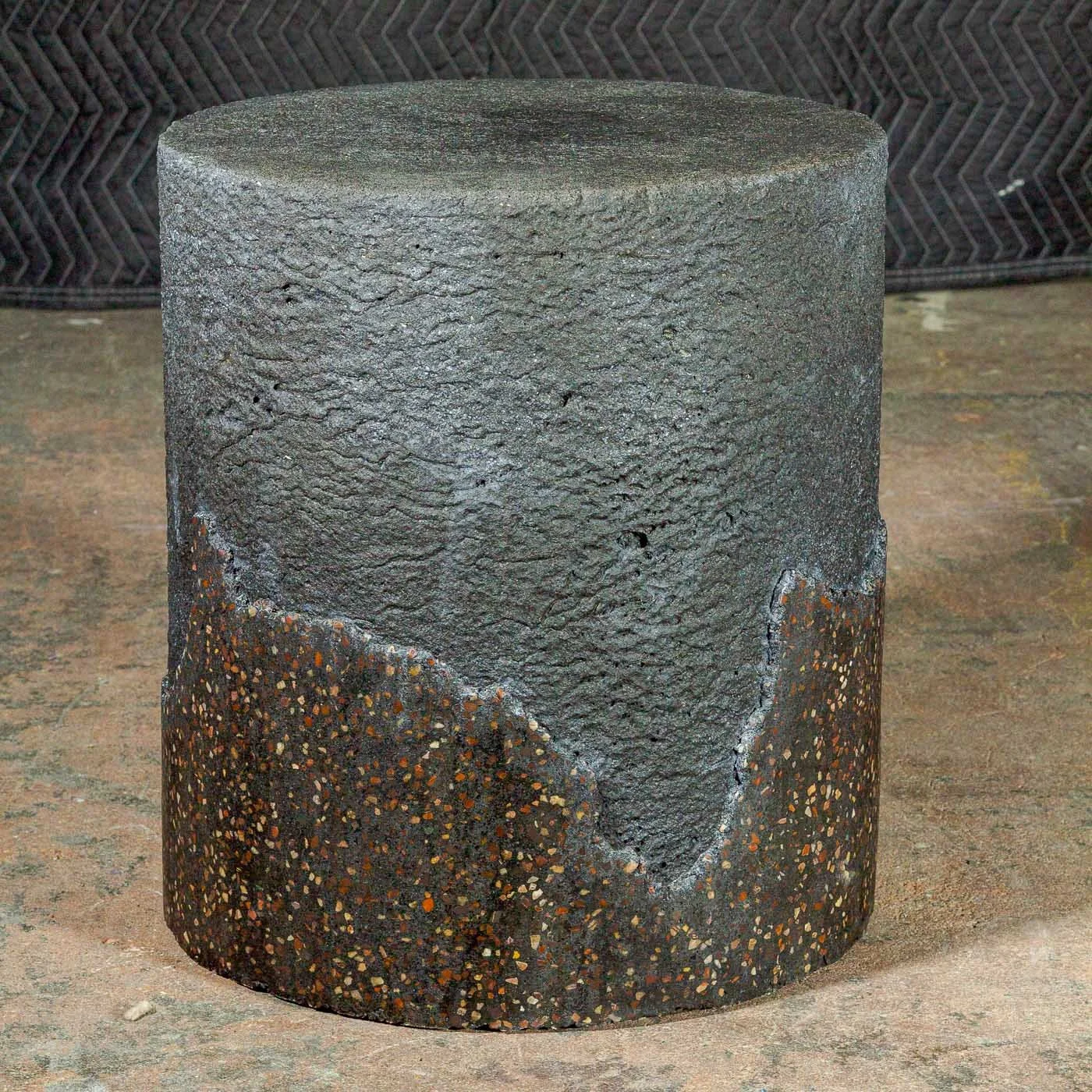 Concrete side table from line DEGRADATION Broken Terrazzo series with fractured aggregate transition and layered volcanic surface by Dylan Myers.