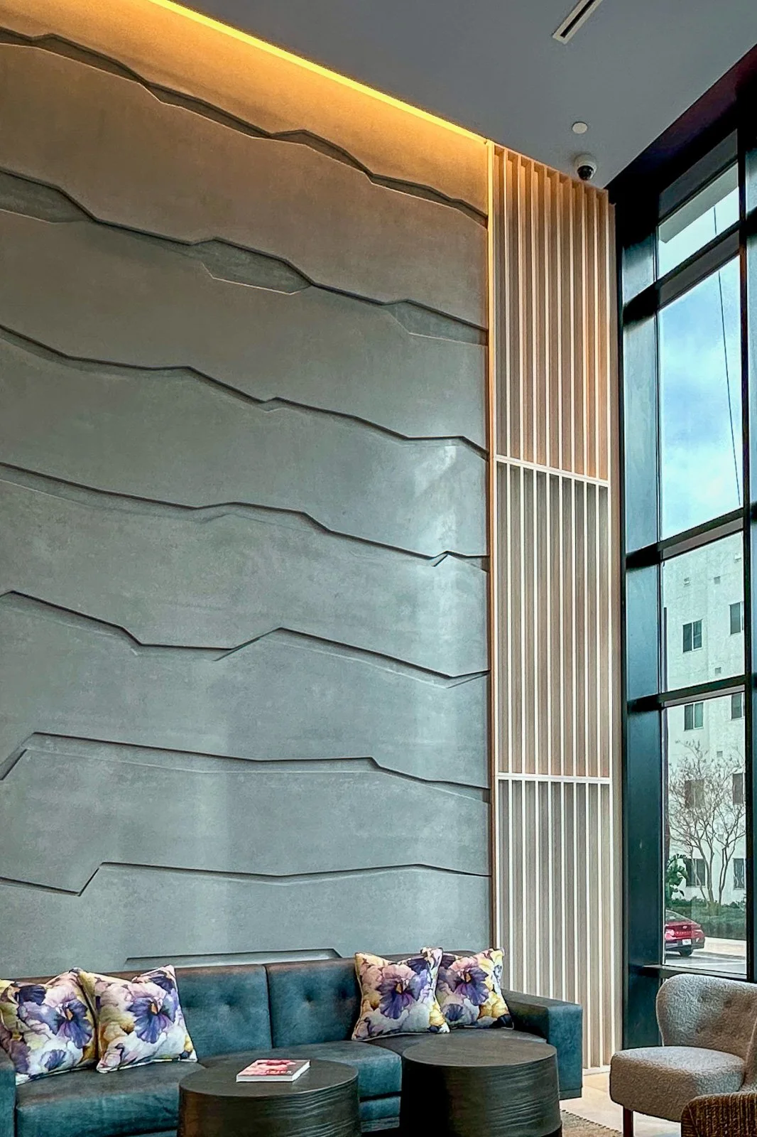 Large-scale sculptural concrete wall system by The Concrete Anomaly featuring monolithic panel geometry, integrated reveals, and mineral-toned architectural surfaces.