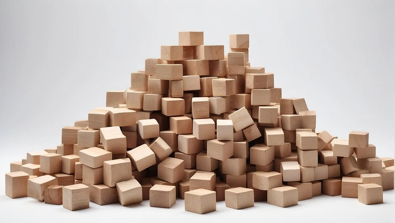 Wooden blocks representing structured and organized dental hygiene board exam preparation