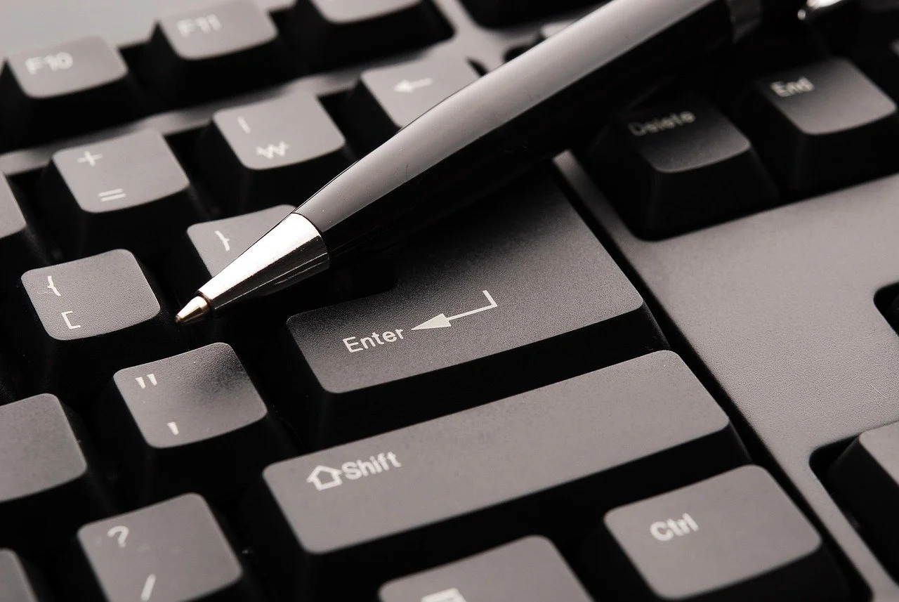 Keyboard and pen representing step-by-step dental hygiene board application guidance