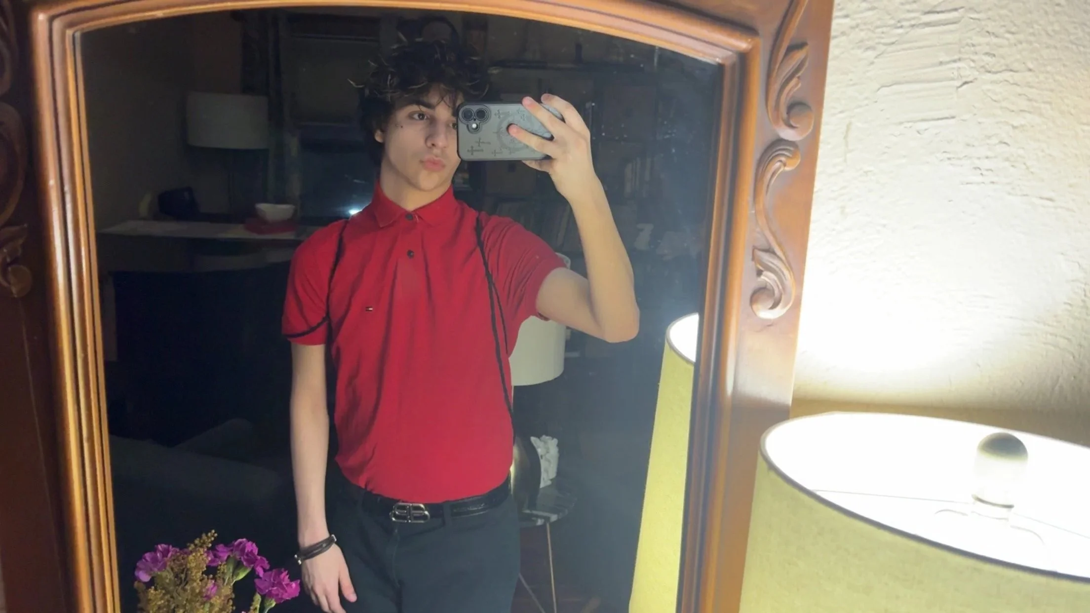 Nighttime landscape with star-filled sky, bright planet or star at the center, silhouettes of mountains, and a calm body of water reflecting the night sky.