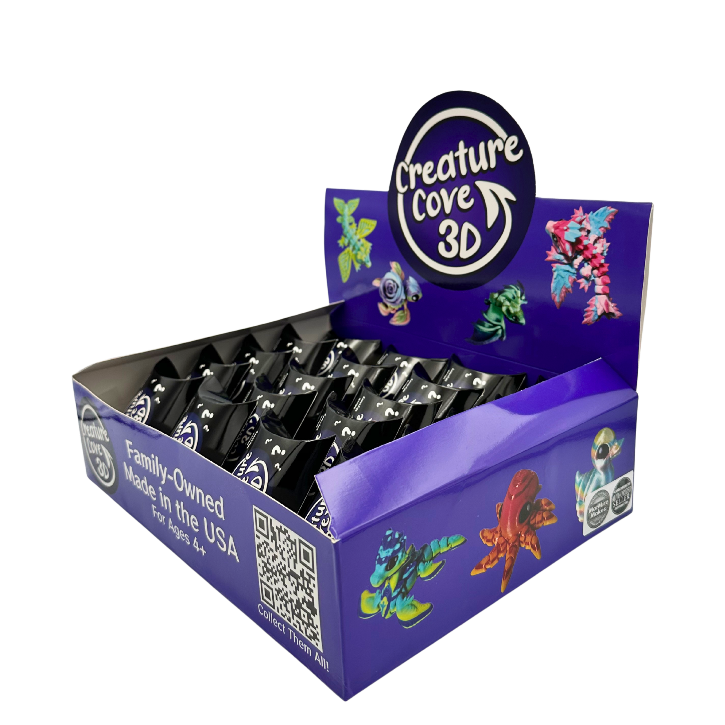 A display box labeled "Creature Cove 3D" containing small toy figurines of colorful, fantasy creatures.