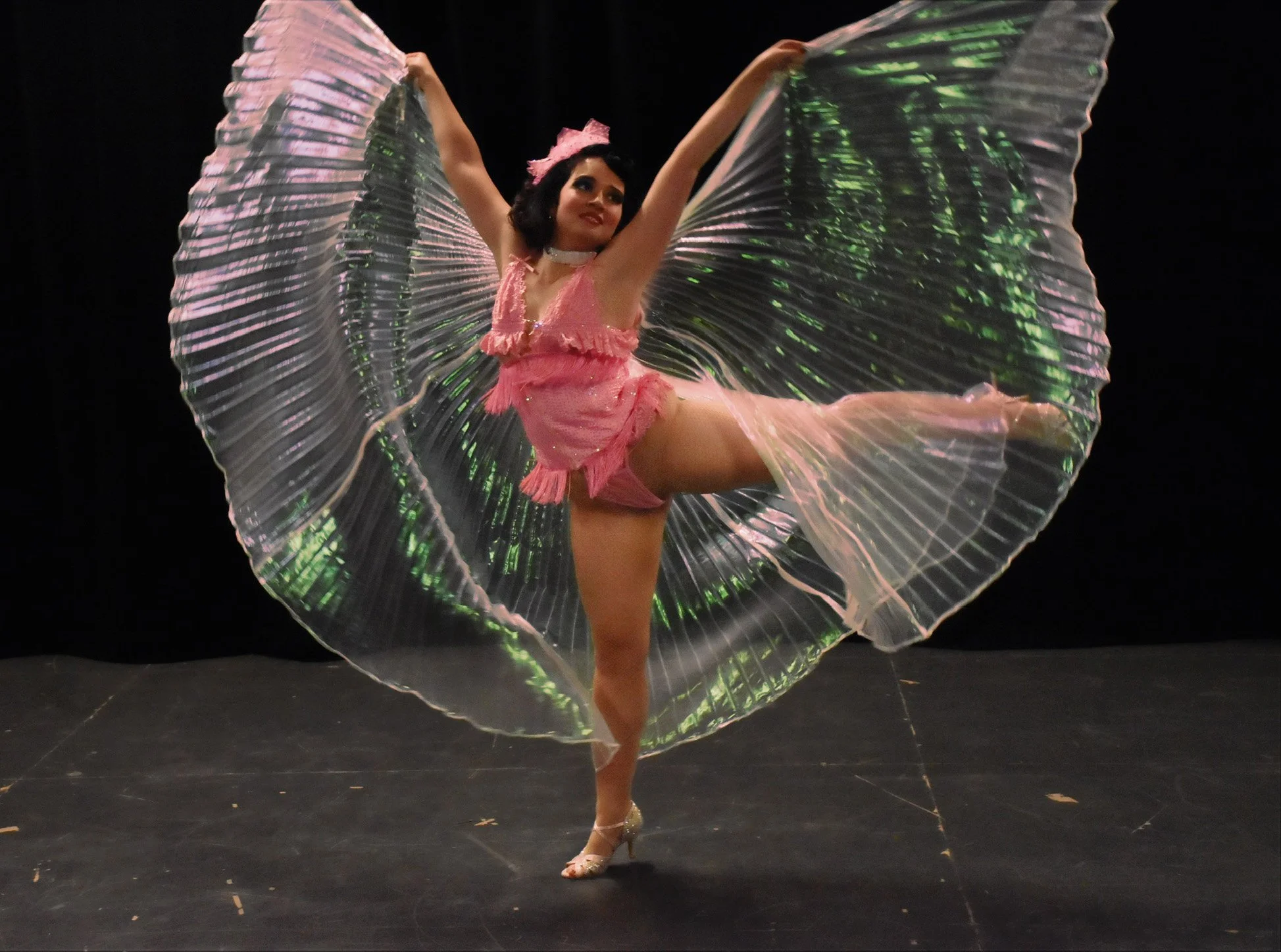 Bambi Karloff dancing with wings.
