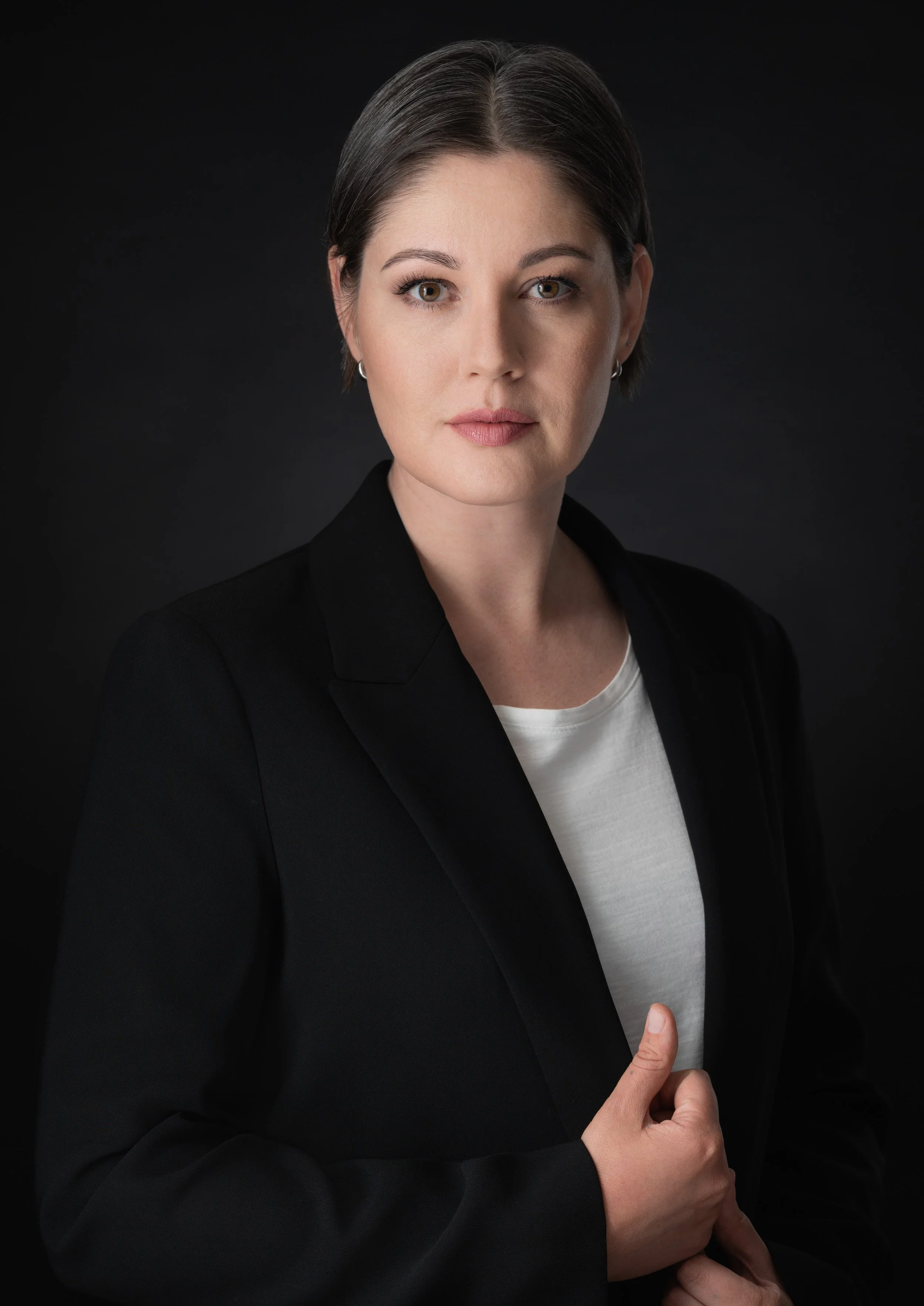 Professional LinkedIn business headshot captured in a studio, perfect for corporate branding