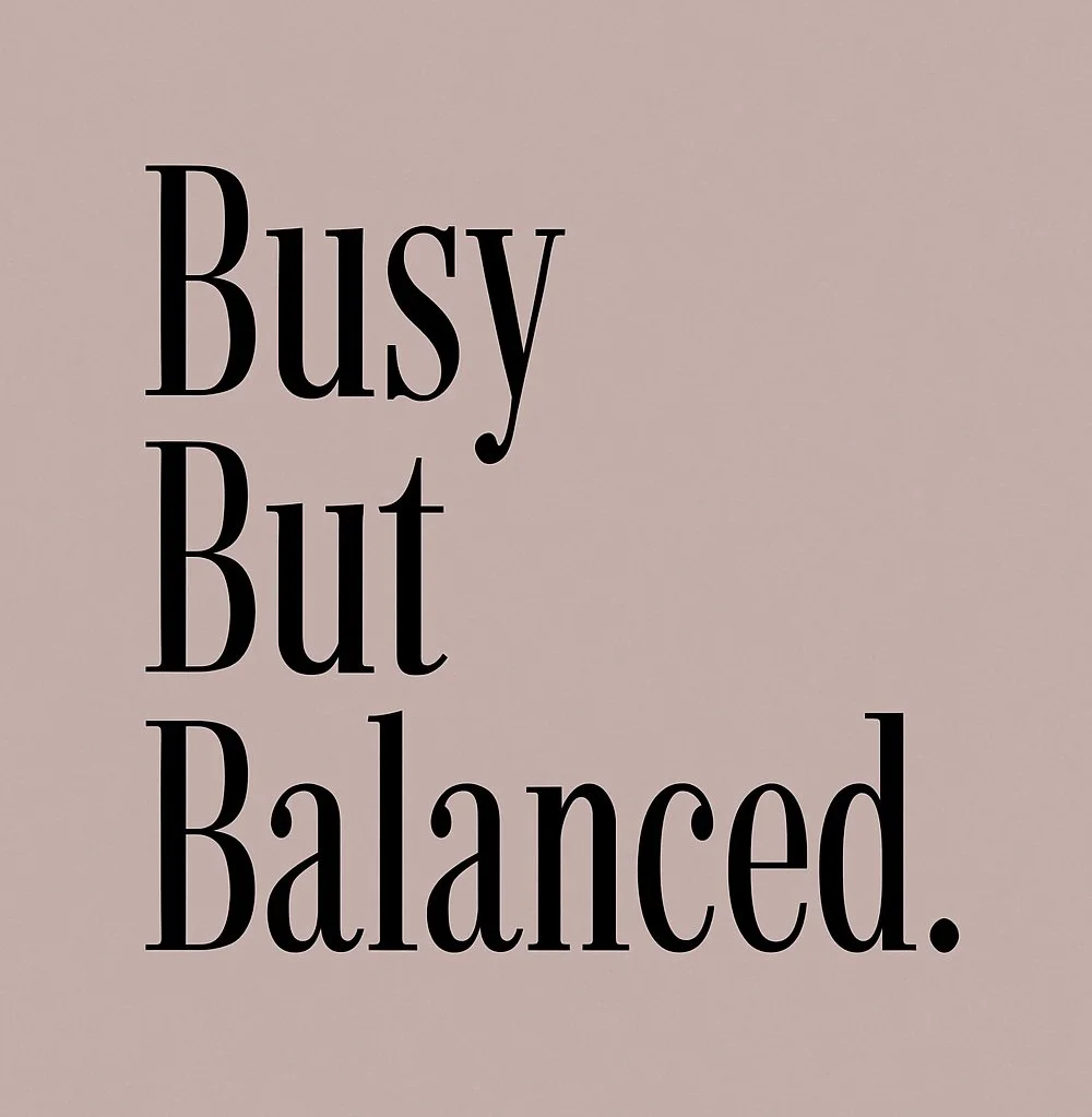 A motivational quote that reads, "Busy But Balanced," in black text on a pale pink background.