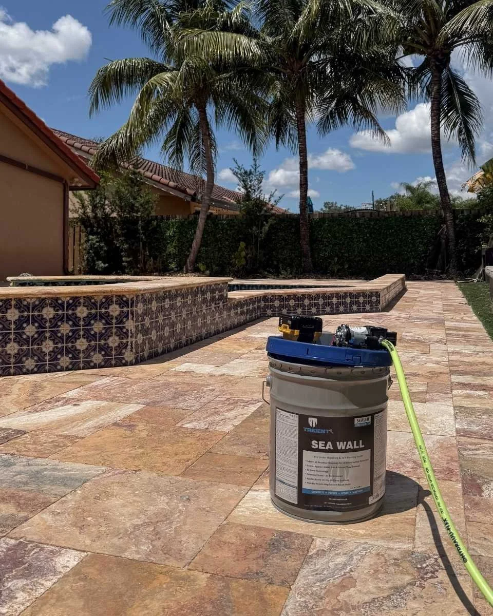 Prepared travertine pool deck with penetrating stone sealer during a natural stone sealing project in Coral Springs.
