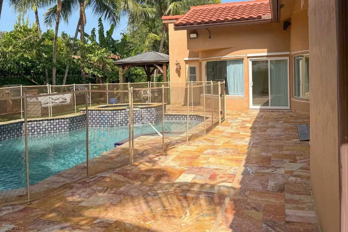Cleaned and sealed travertine pool deck and patio in Coral Springs after surface preparation