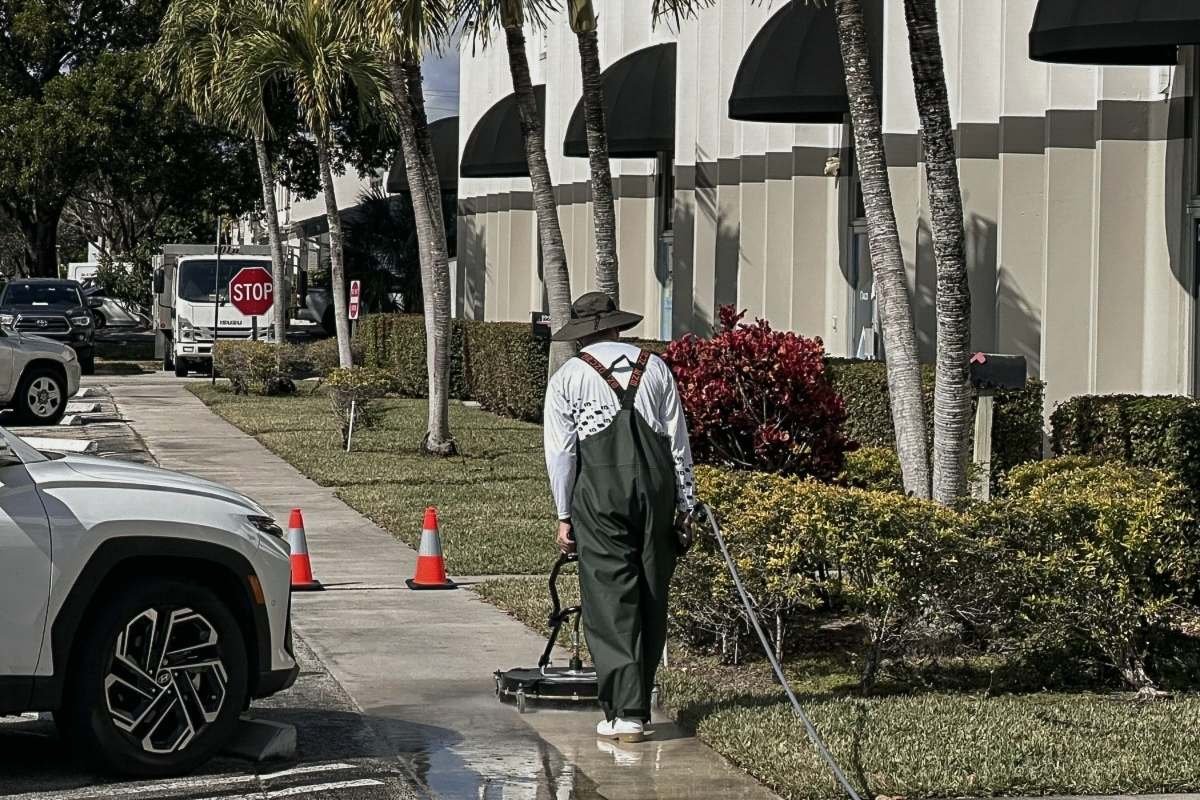 Commercial sidewalk cleaning at a managed property in Broward County.