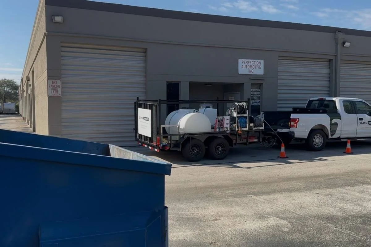 Exterior cleaning for a managed commercial property in Broward County, including walkways and service areas.