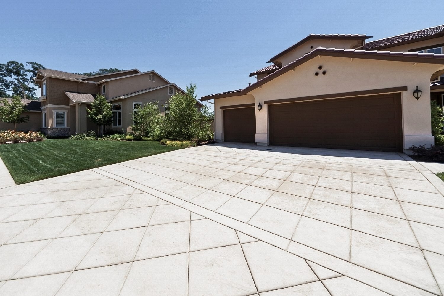 Concrete driveway with rust and surface stains caused by outdoor exposure in South Florida.