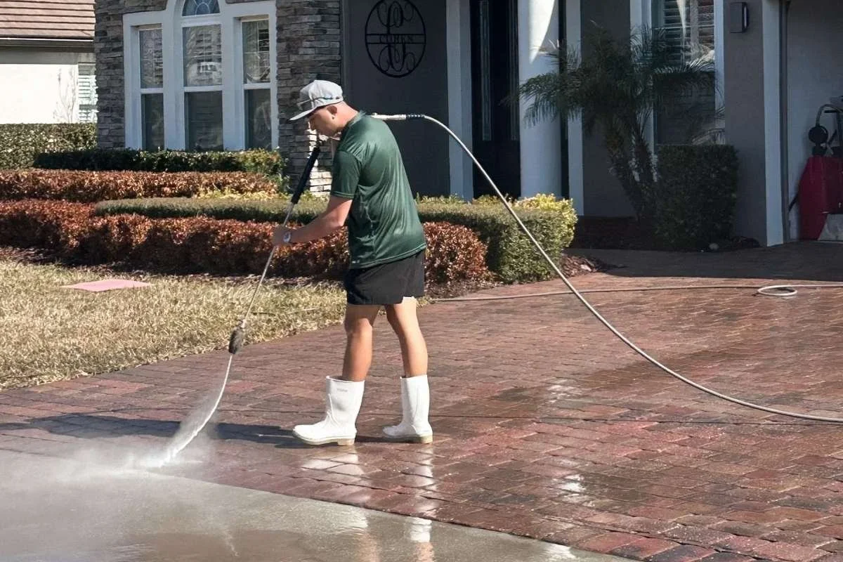 Professional paver cleaning in Broward County preparing the surface before sealing evaluation.