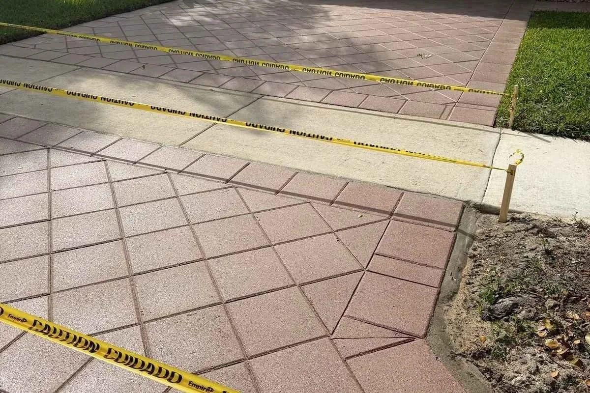 Sealed paver surface with enhanced color and protection against moisture in South Florida conditions.