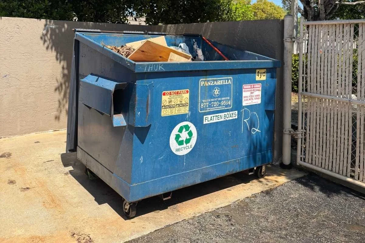 Dumpster enclosure cleaning in Broward County for a commercial waste area.