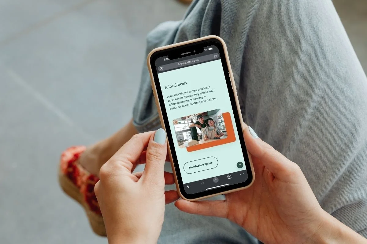 Hands holding a phone while submitting a One Space, One Story nomination.