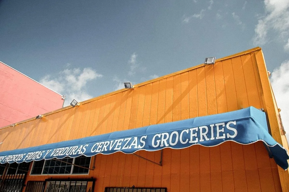 Local Broward market with a colorful storefront, representing the everyday places that shape community life.