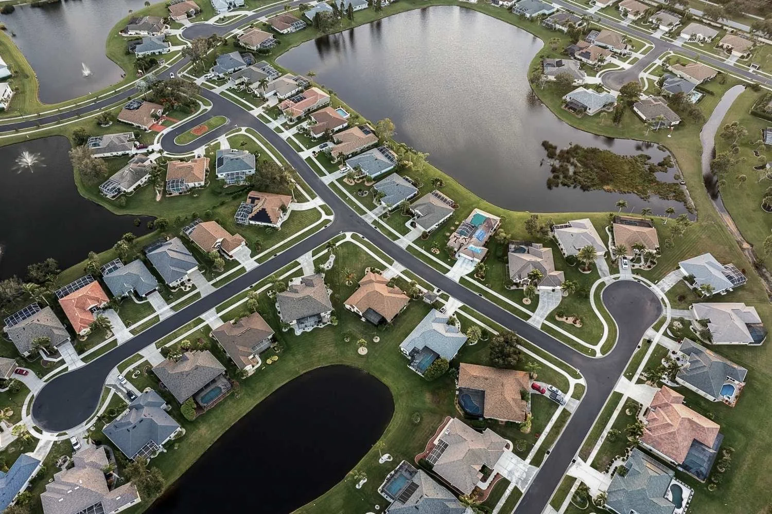 Residential neighborhood in South Florida showing exterior surfaces exposed to humidity, rain, and year-round weather.