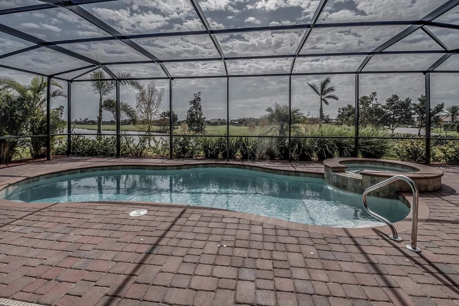 Screened patio and pool area exposed to South Florida humidity, rain, shade, and outdoor buildup.