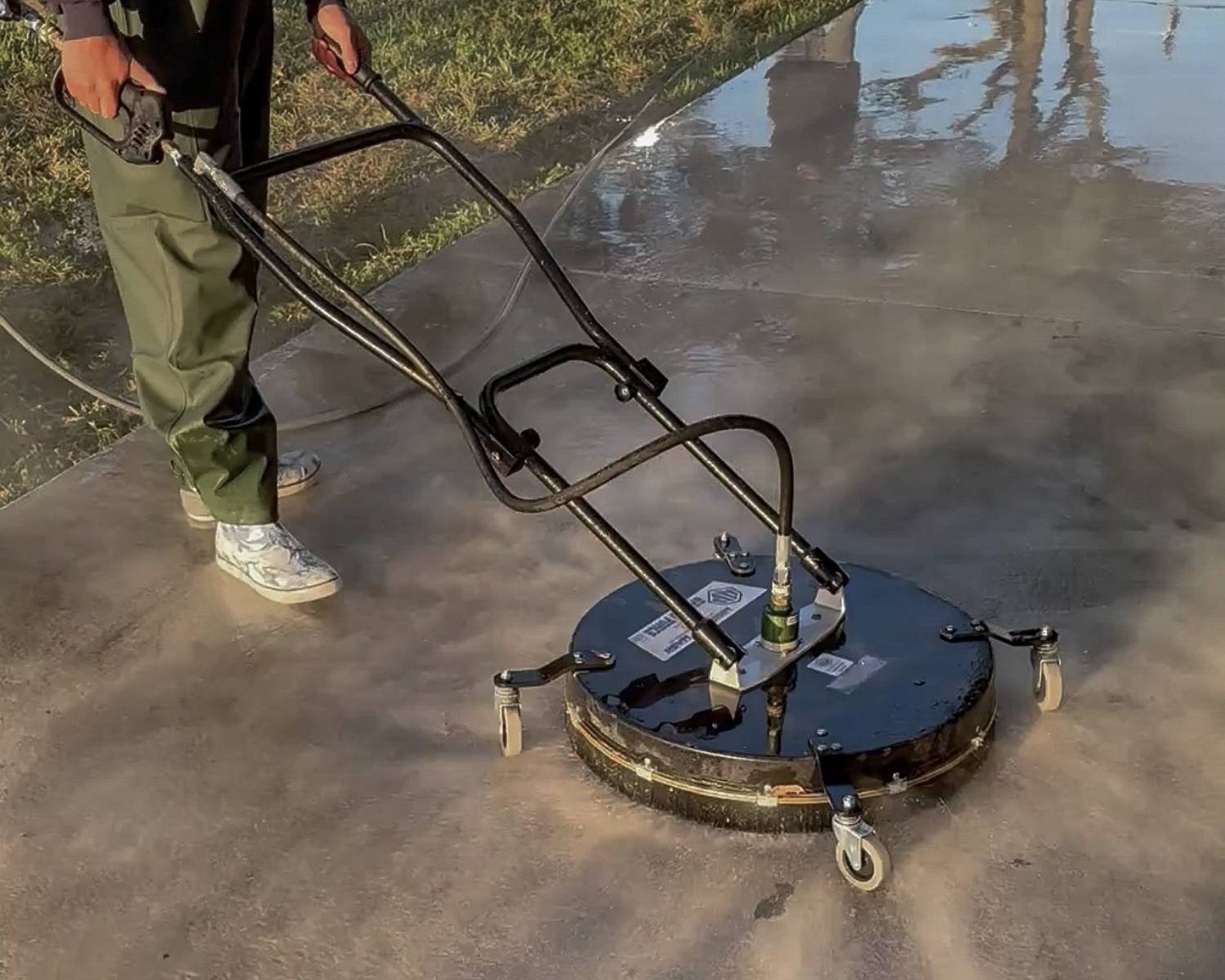 Professional surface cleaner being used during a driveway cleaning process in Broward County.
