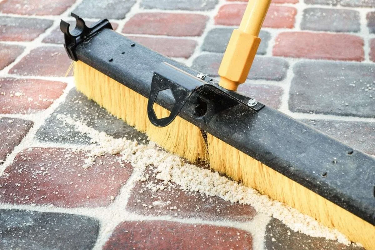 Close-up of stabilized joint sand between pavers after professional sealing process.