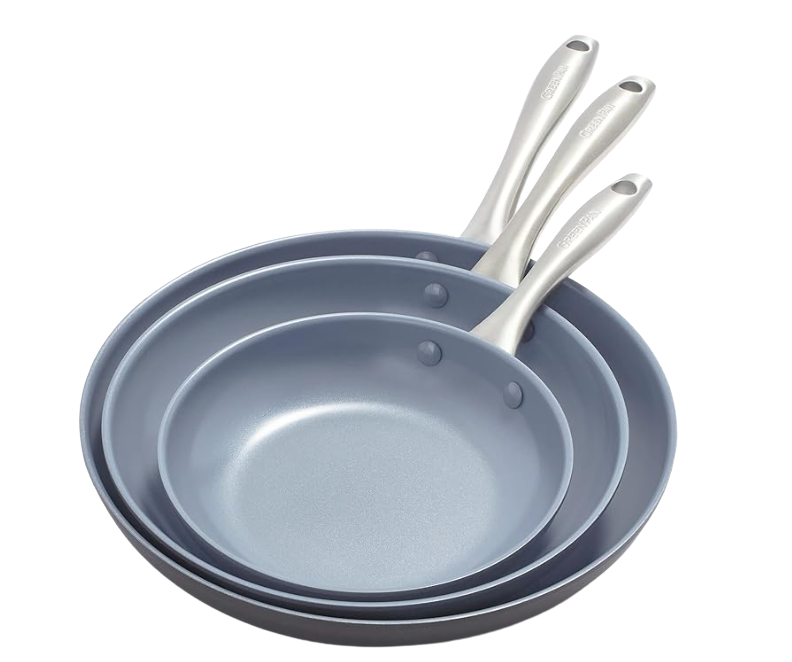 Three non-stick frying pans stacked in size with metal handles.
