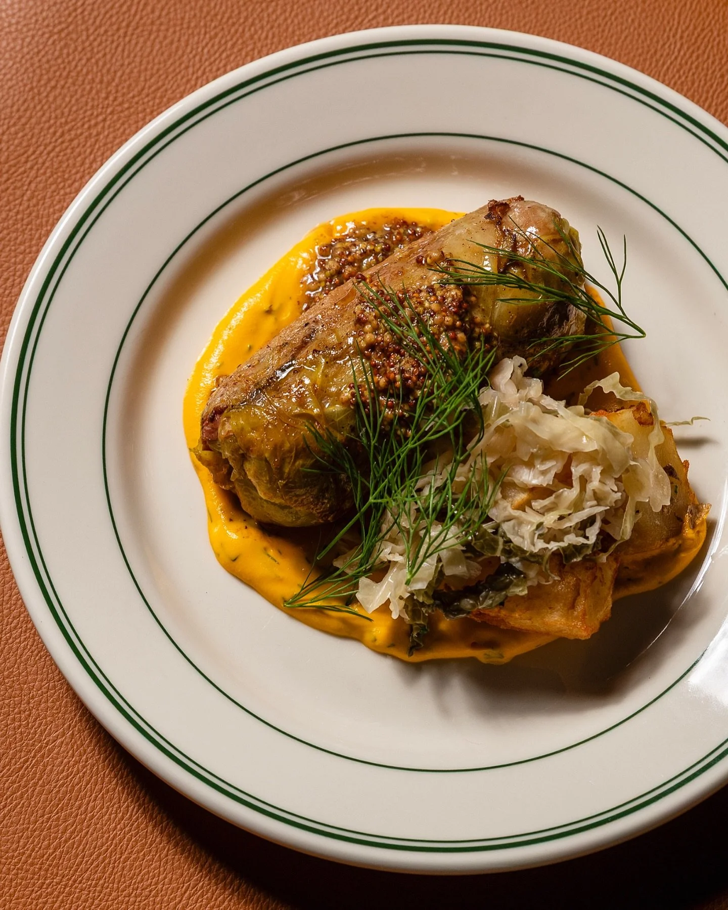 Friends, this is our Corned Beef Dolma >> available tonight through the weekend.

Cabbage-wrapped housemade corned beef courtesy of the butchers downstairs @marrow_provisions , carrot-dill puree, sauerkraut fried potatoes, mustard jus

Come get