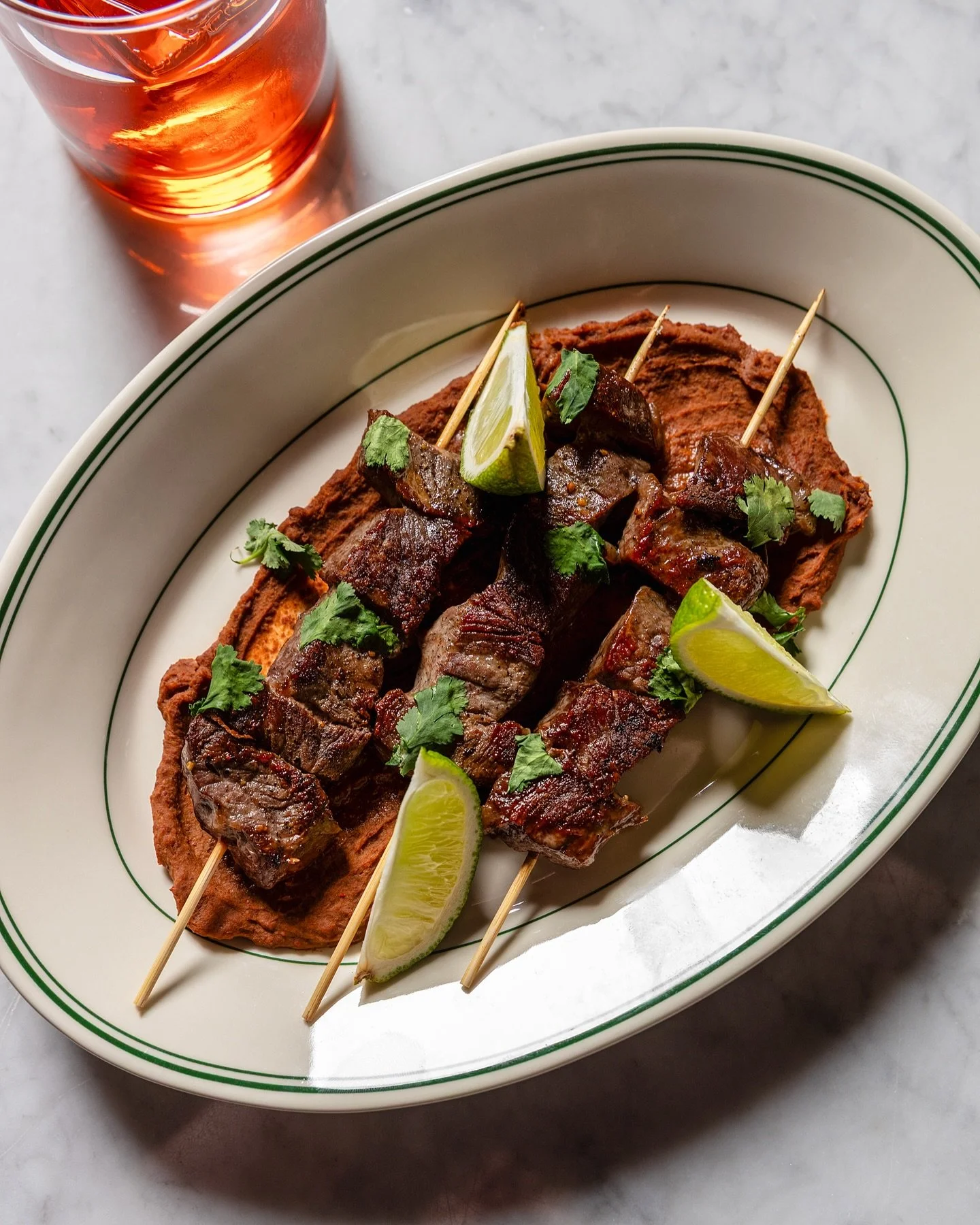 Butcher Block Only >> Beef Negimaki Skewers

Marinated beef, black bean puree, cilantro. Downstairs at the bar.

The negimaki skewers are one of those things you don&rsquo;t expect to find on a happy hour menu, and then you order them, and then