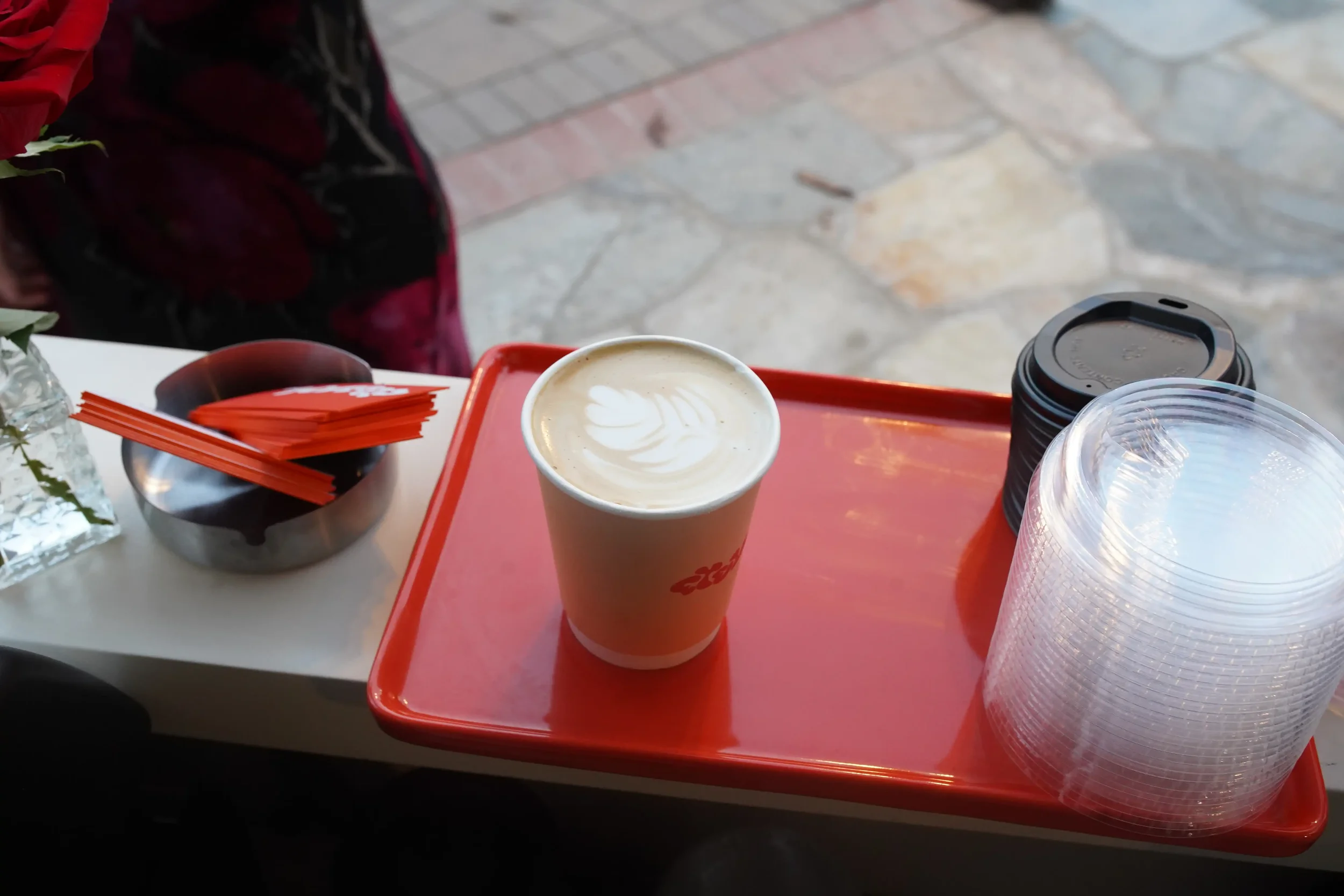 A finished latte on the service tray