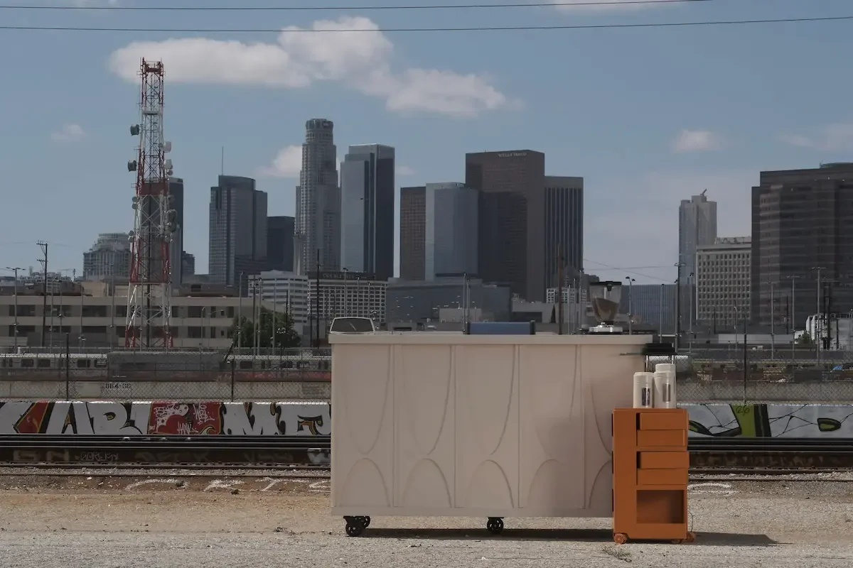 Mobile coffee cart with skyline of los angeles in background