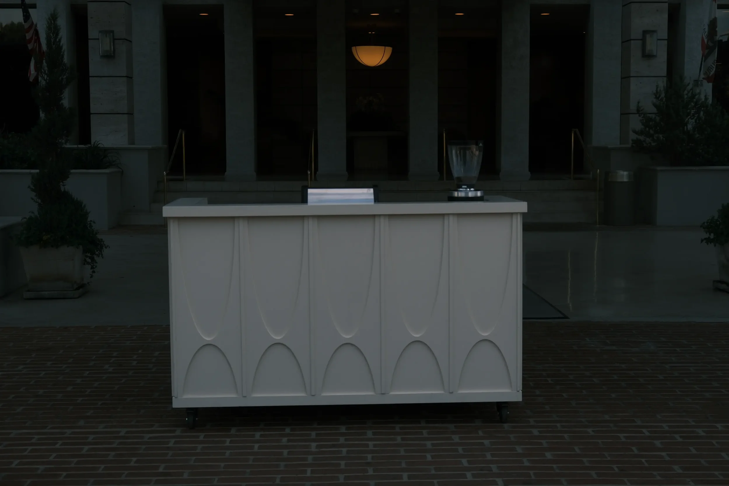 Eyevel cart at an office building entrance at dusk