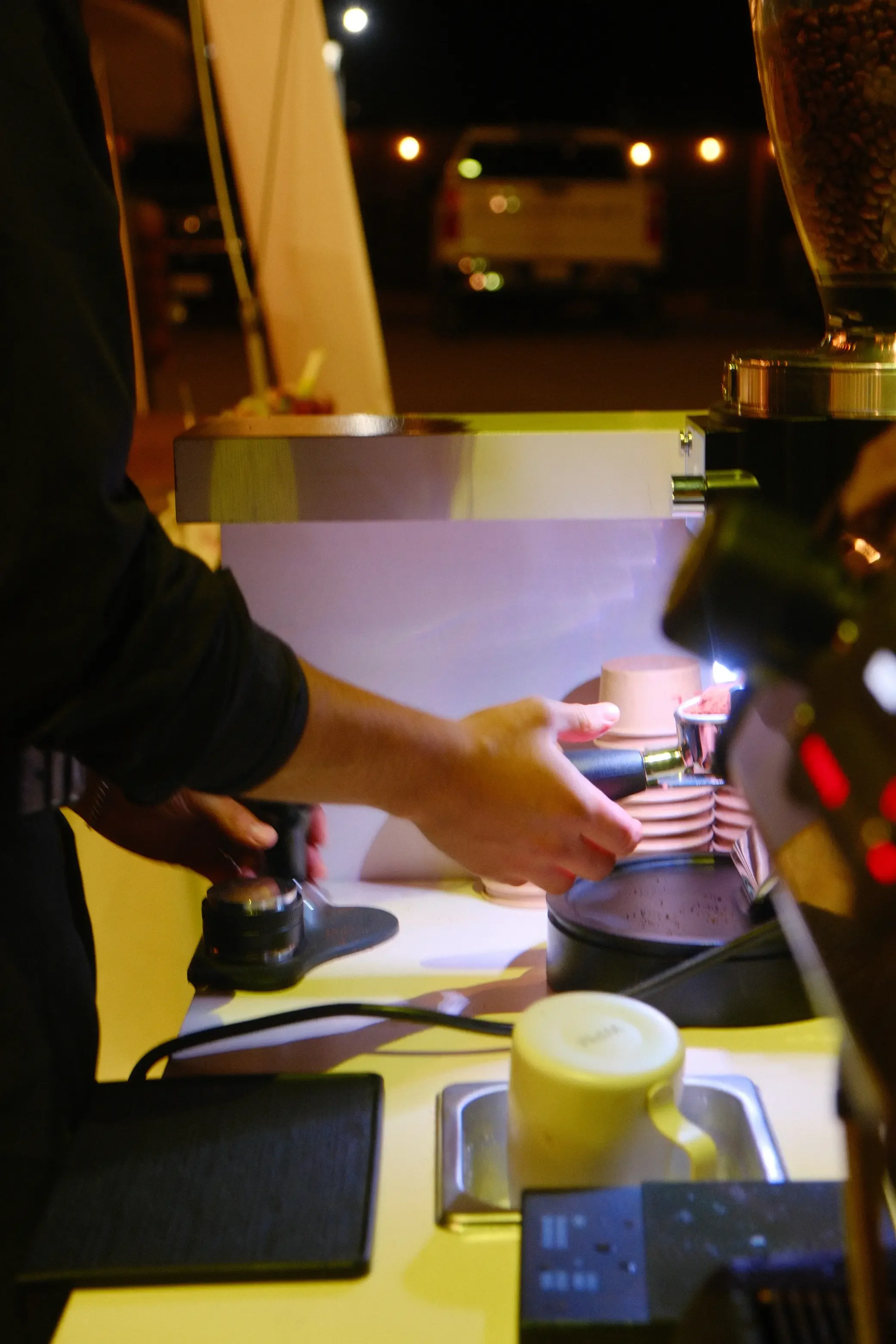 Eyevel barista crafting drinks behind the espresso bar
