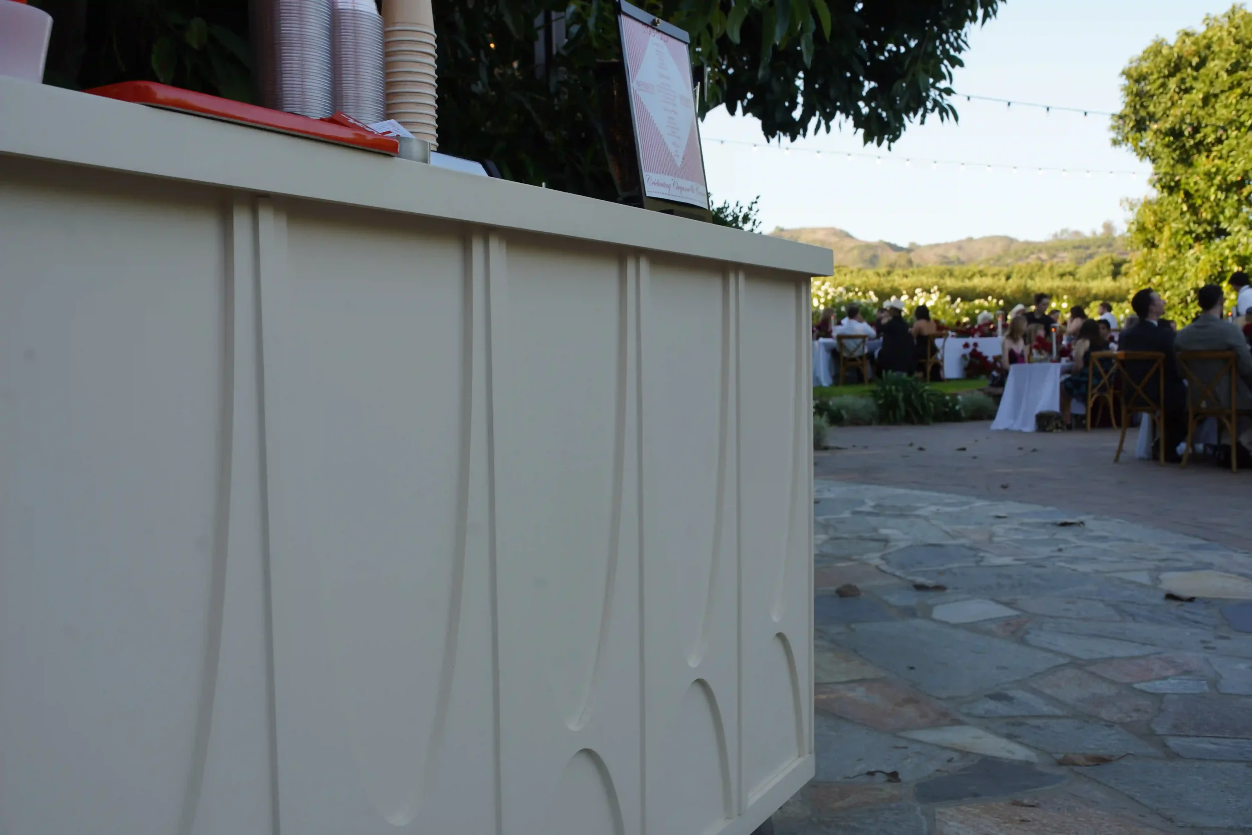 The sculpted arch paneling along the side of the cart