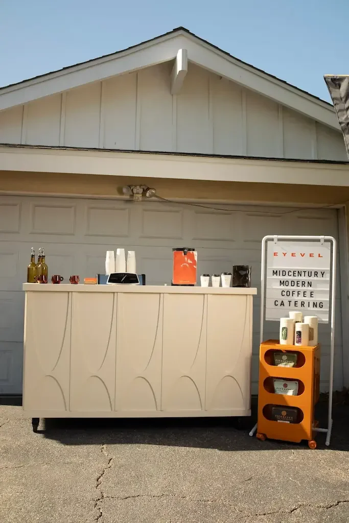 Mobile Coffee cart rental in los angeles positioned outside of a garage.
