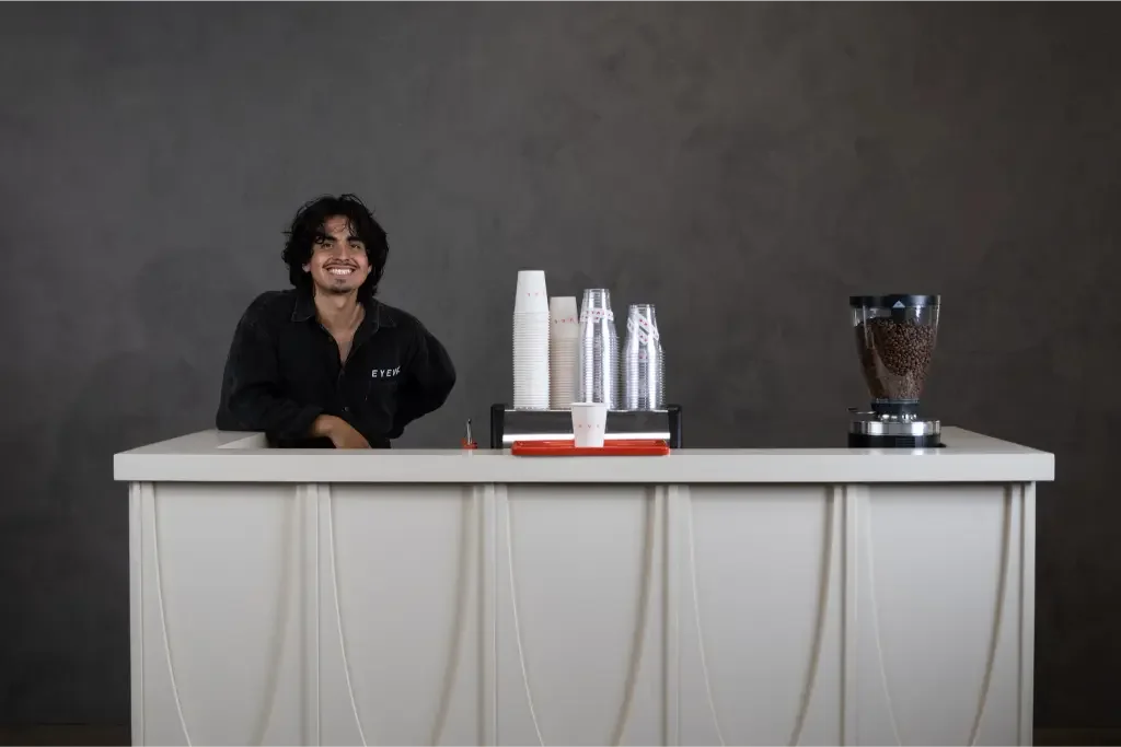 Levi behind the Eyevel espresso bar at a corporate event