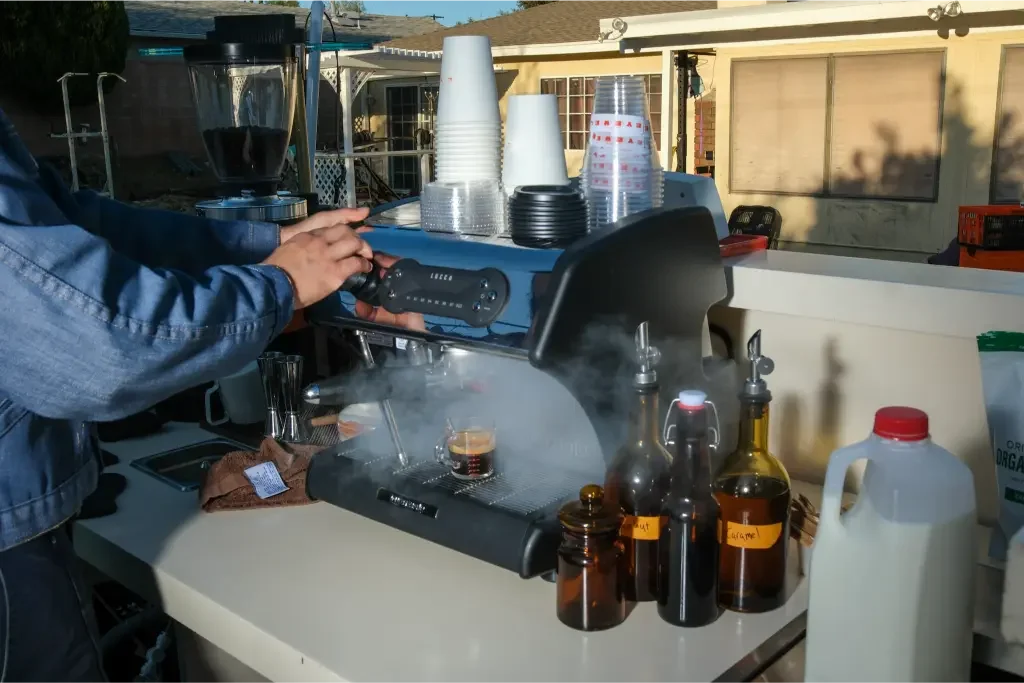 Eyevel barista crafting drinks at the espresso bar, photo 23