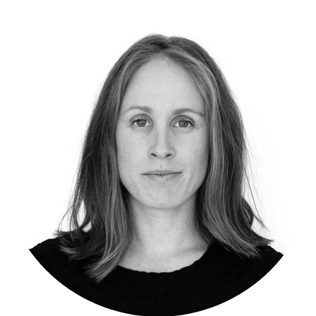 Black and white portrait of a woman with shoulder-length hair, facing forward with a neutral expression.