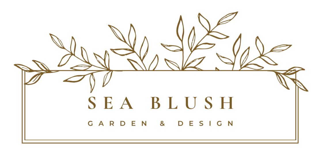 A logo for Sea Blush Garden & Design with brown leafy branches above and below, a white rectangular background, and gold and brown text.