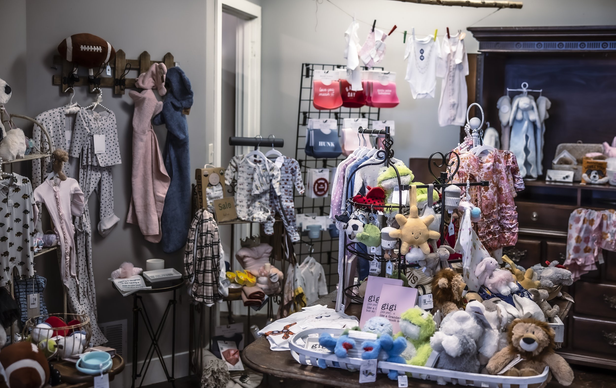 Various baby items including clothing and toys