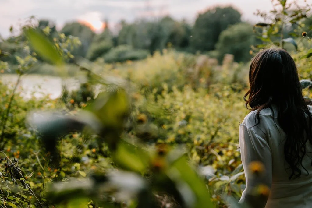 Cheryl Grant in a quiet forest pathway symbolizing emotional clarity and the journey toward inner wisdom.