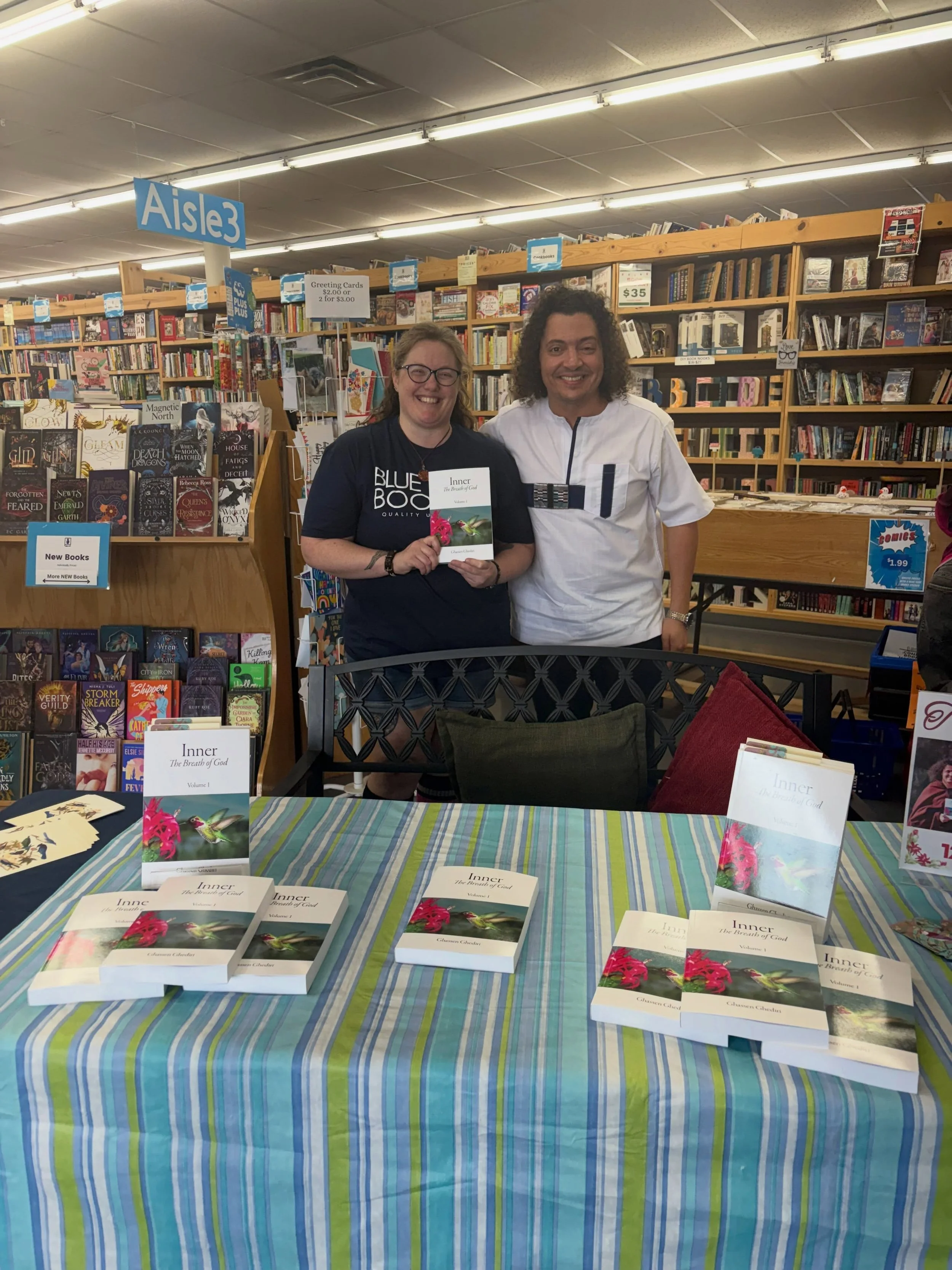 Ghediri and a reader during his book signing event in Michigan