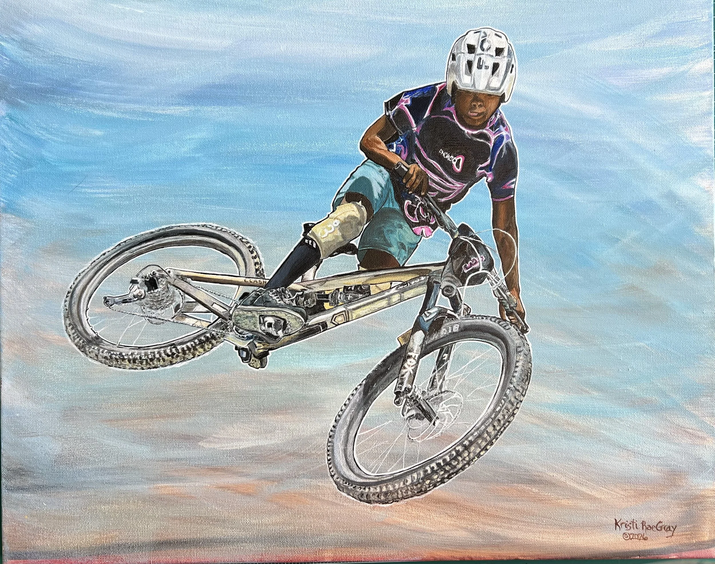 A young man makes a jump with his mountain bike, concentration on his face. He sent it!